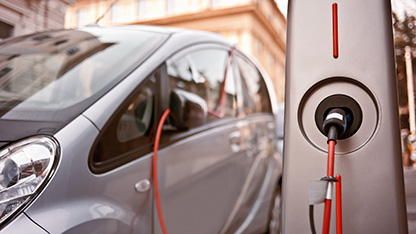 A modern electric vehicle being charged